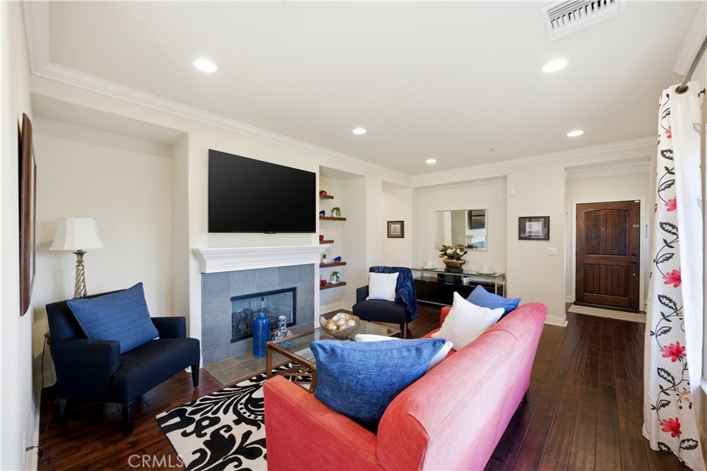 2454 Oswego Street, Unit 301 Pasadena, CA 91107 - Photo 5 of 59 a living room with fireplace furniture and a flat screen tv