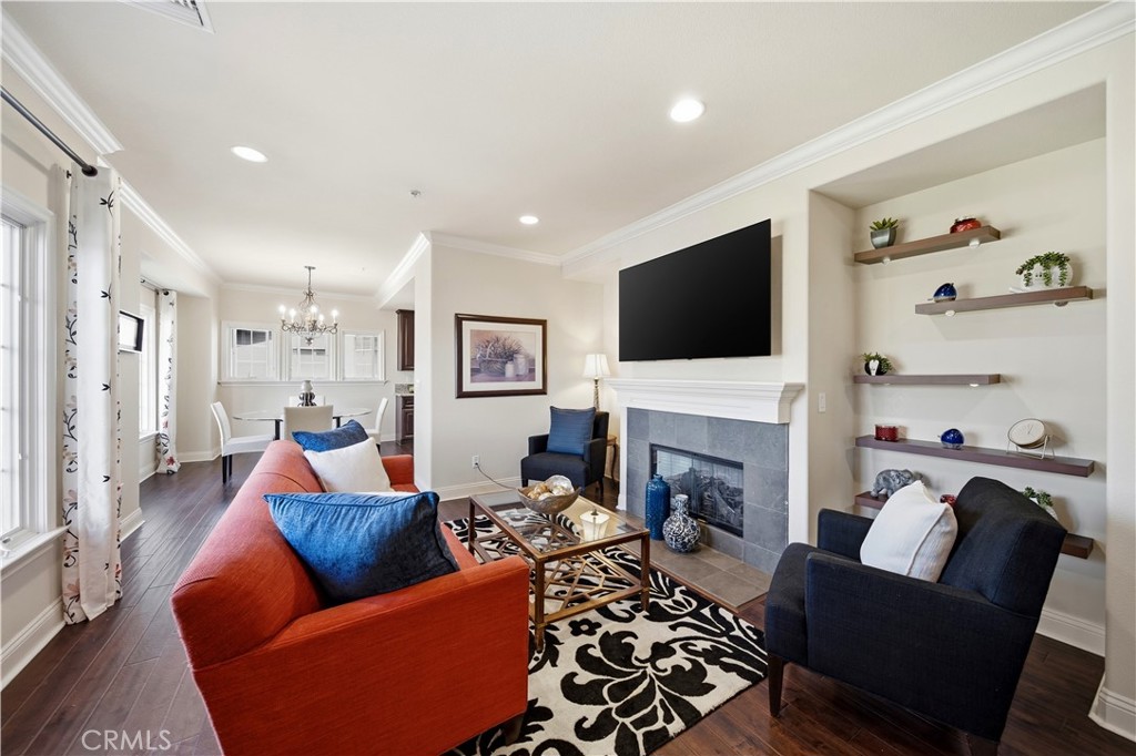 2454 Oswego Street, Unit 301 Pasadena, CA 91107 - Photo 8 of 59 a living room with furniture a fireplace and a flat screen tv