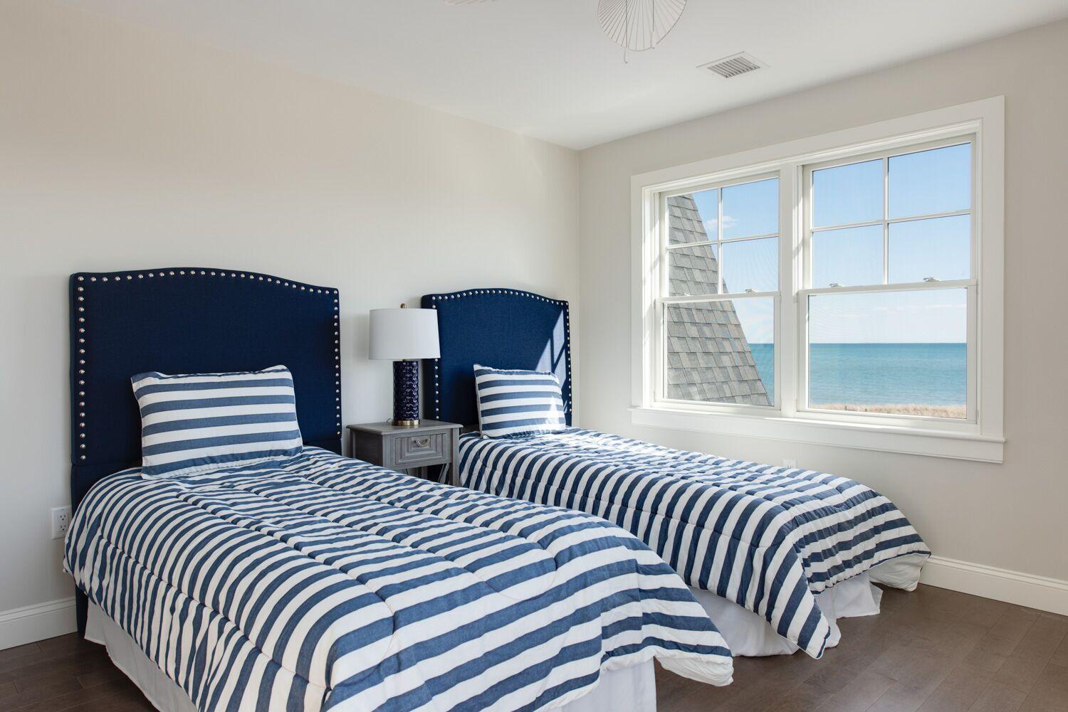 6 Beach Road Mashpee, MA 02649 - Photo 15 of 25 a bedroom with two beds and a window