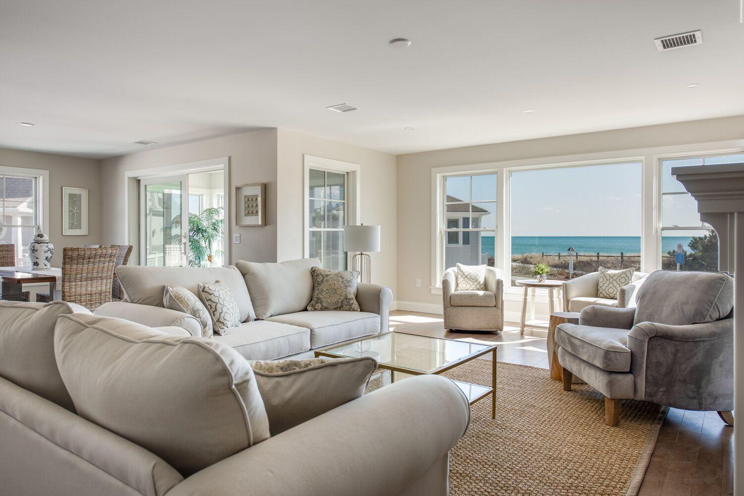6 Beach Road Mashpee, MA 02649 - Photo 2 of 25 a living room with furniture and a large window