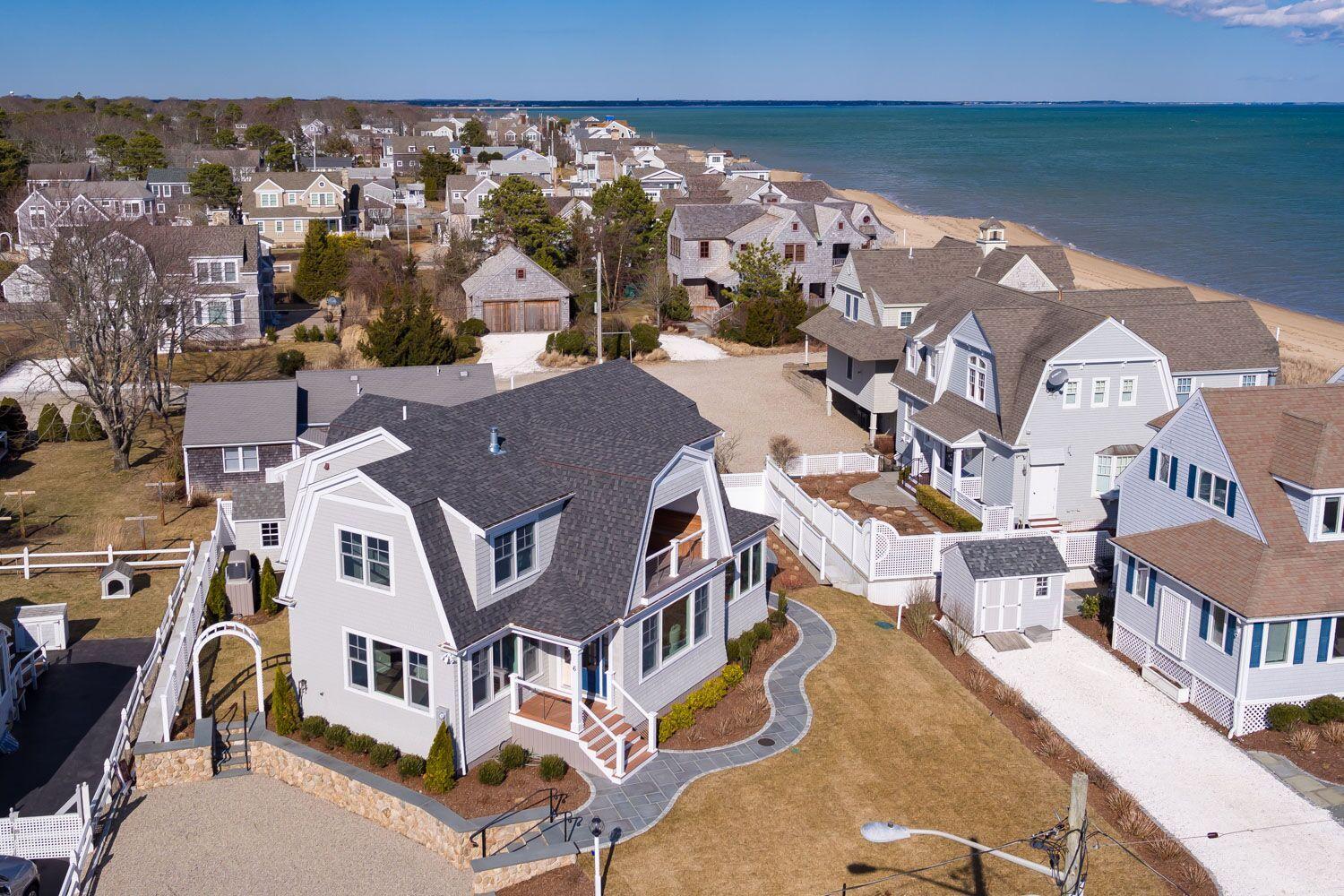 6 Beach Road Mashpee, MA 02649 - Photo 21 of 25 a view of a city with tall buildings