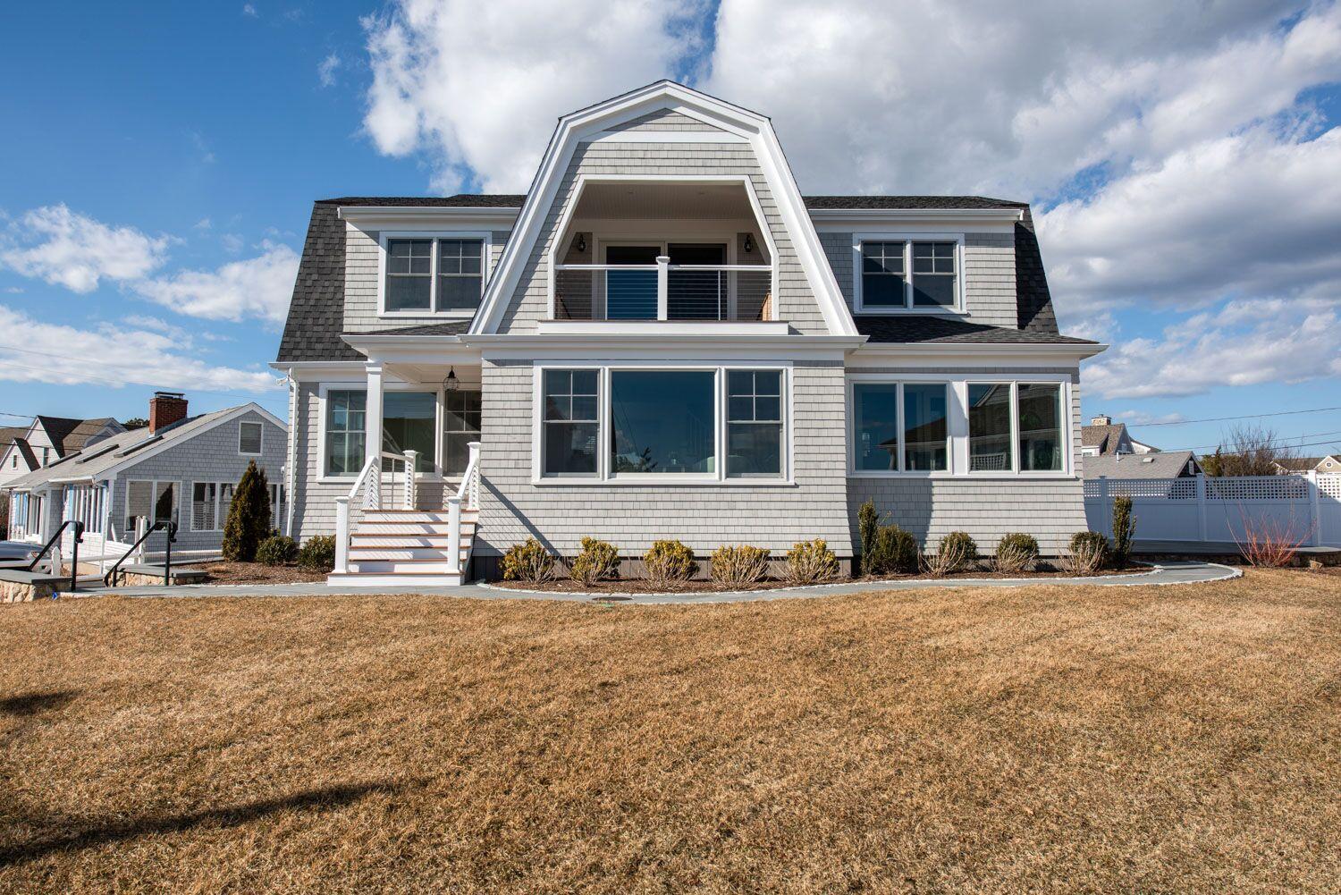 6 Beach Road Mashpee, MA 02649 - Photo 22 of 25 a front view of residential houses with yard