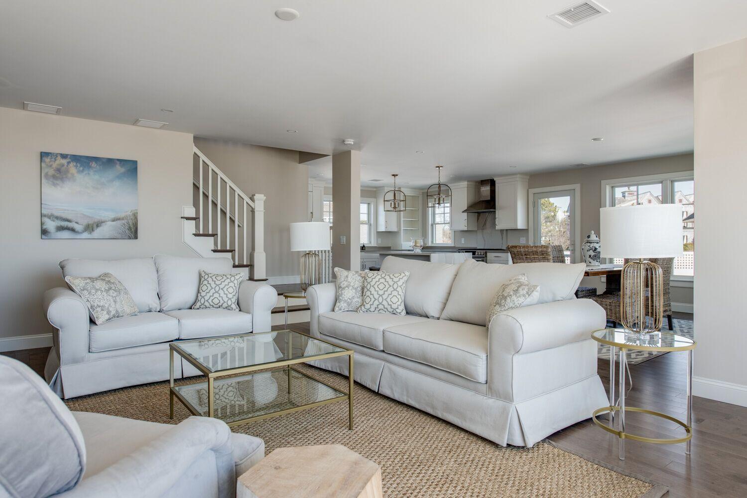 6 Beach Road Mashpee, MA 02649 - Photo 4 of 25 a living room with furniture and a view of kitchen