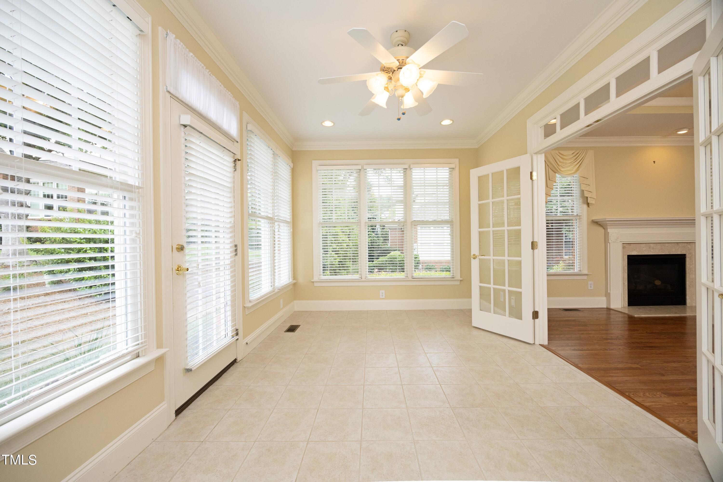 8805 Leeshire Lane Raleigh, NC 27615 - Photo 15 of 26 a view of an empty room with a fireplace and a window