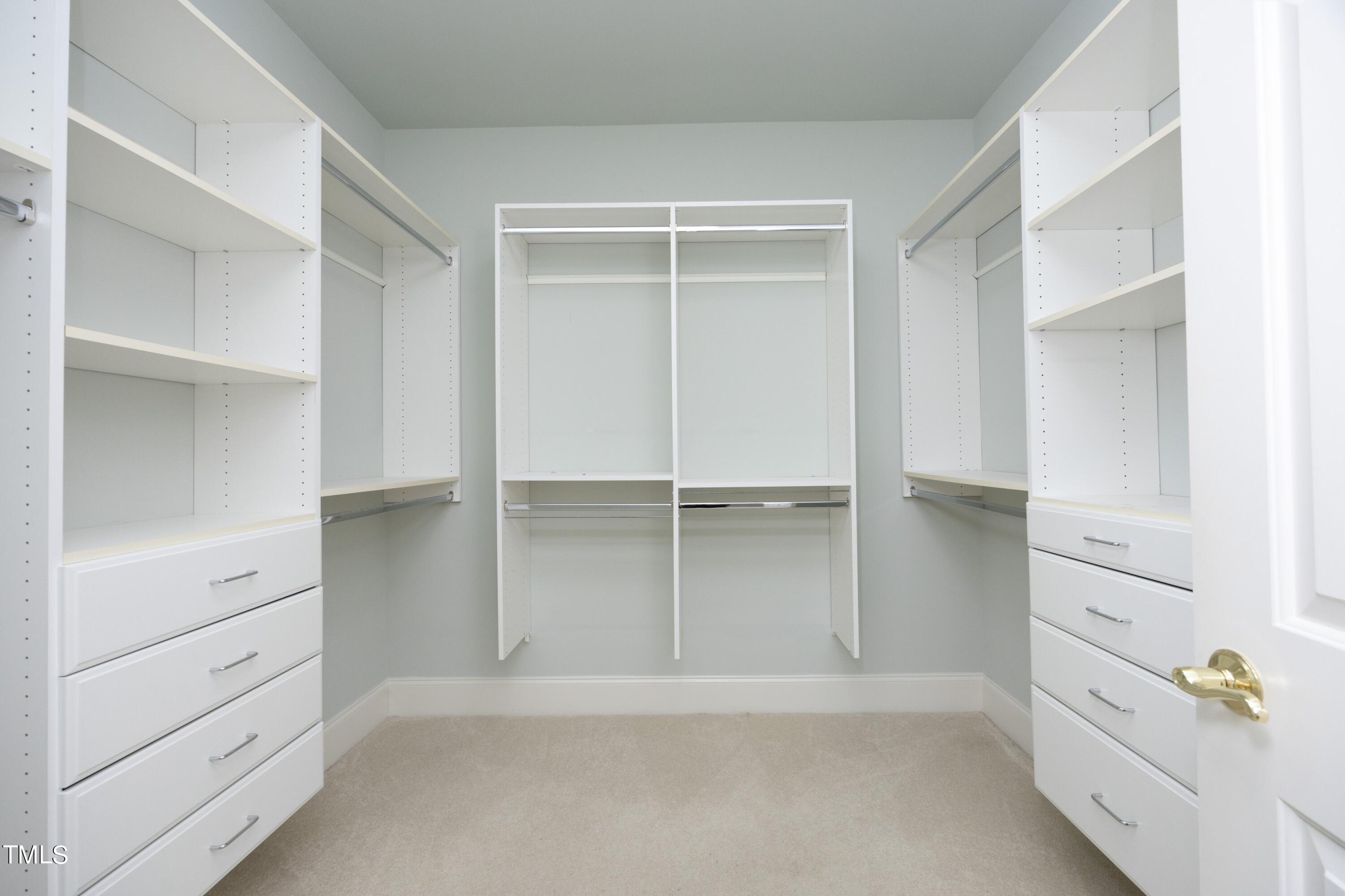8805 Leeshire Lane Raleigh, NC 27615 - Photo 16 of 26 a view of an empty walk in closet