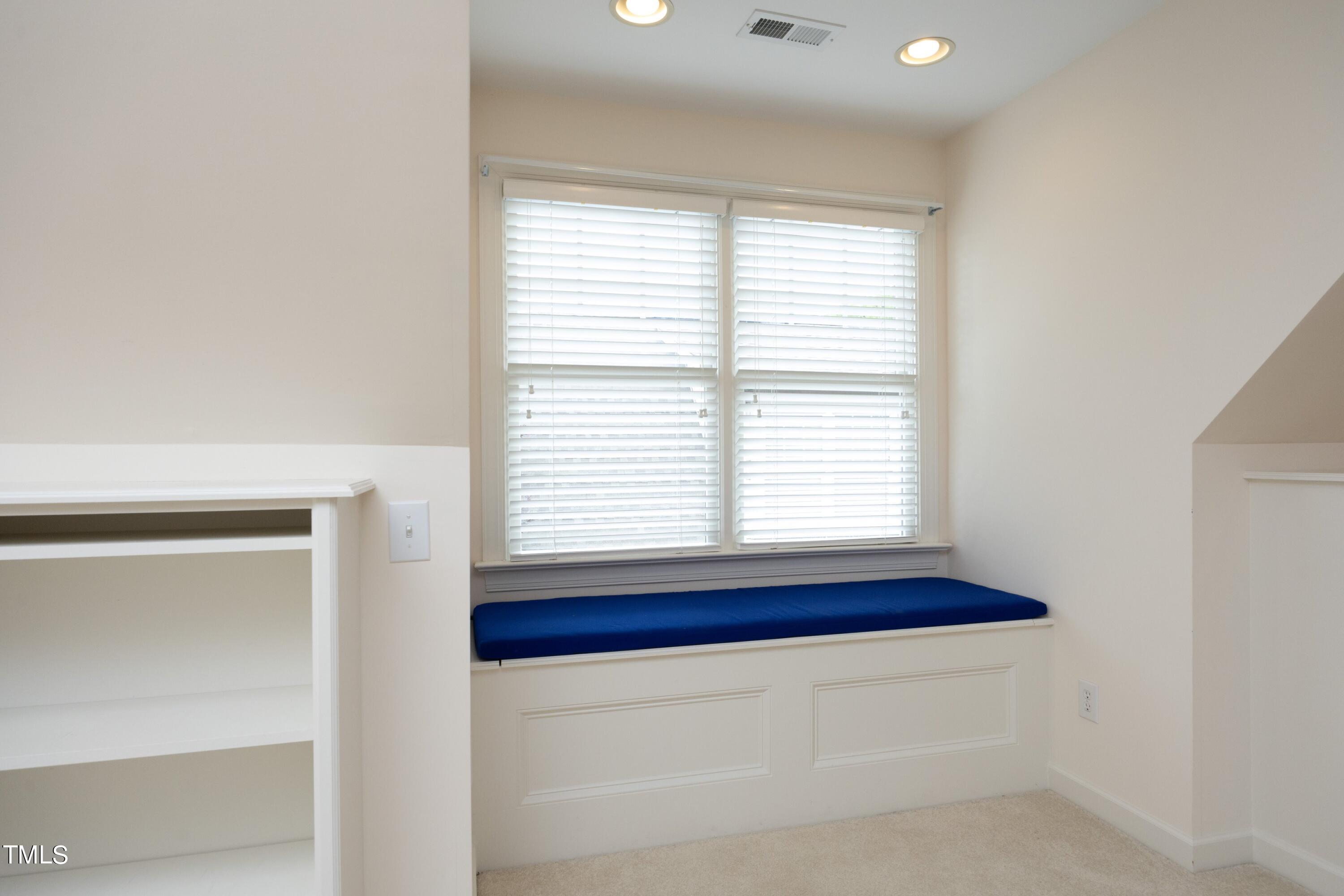 8805 Leeshire Lane Raleigh, NC 27615 - Photo 18 of 26 a bathroom with a bathtub and a window