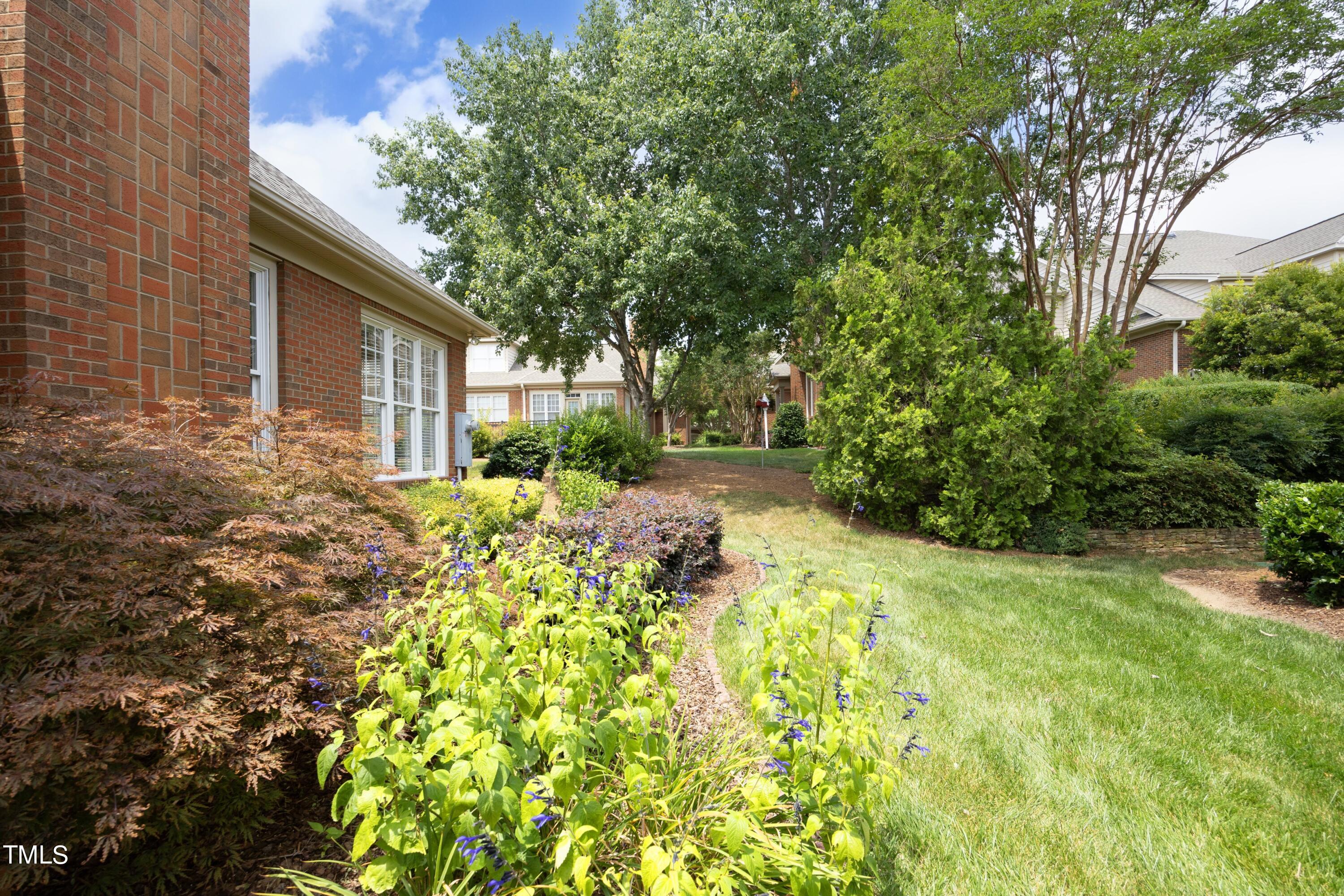 8805 Leeshire Lane Raleigh, NC 27615 - Photo 3 of 26 a backyard of a house with lots of green space