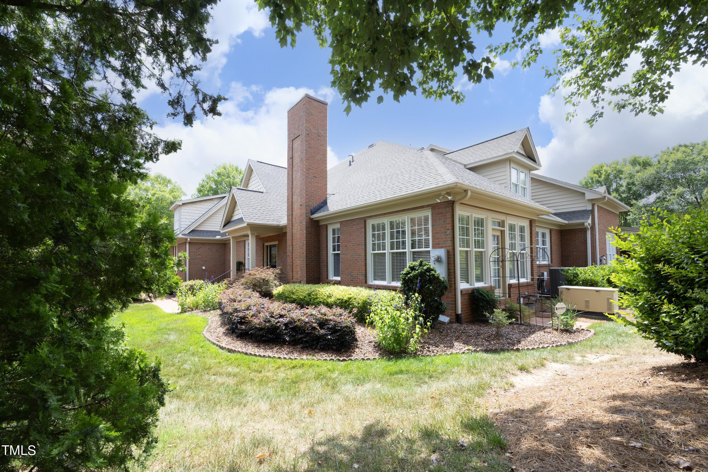 8805 Leeshire Lane Raleigh, NC 27615 - Photo 4 of 26 a front view of a house with yard and green space