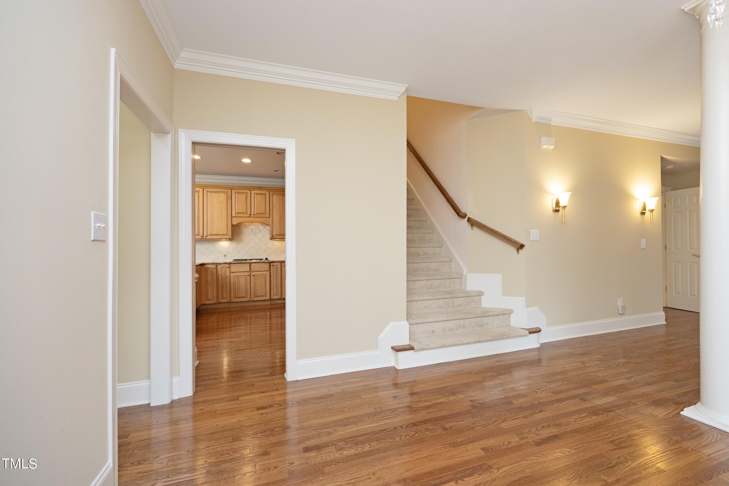8805 Leeshire Lane Raleigh, NC 27615 - Photo 5 of 26 a view of entryway and hall with wooden floor