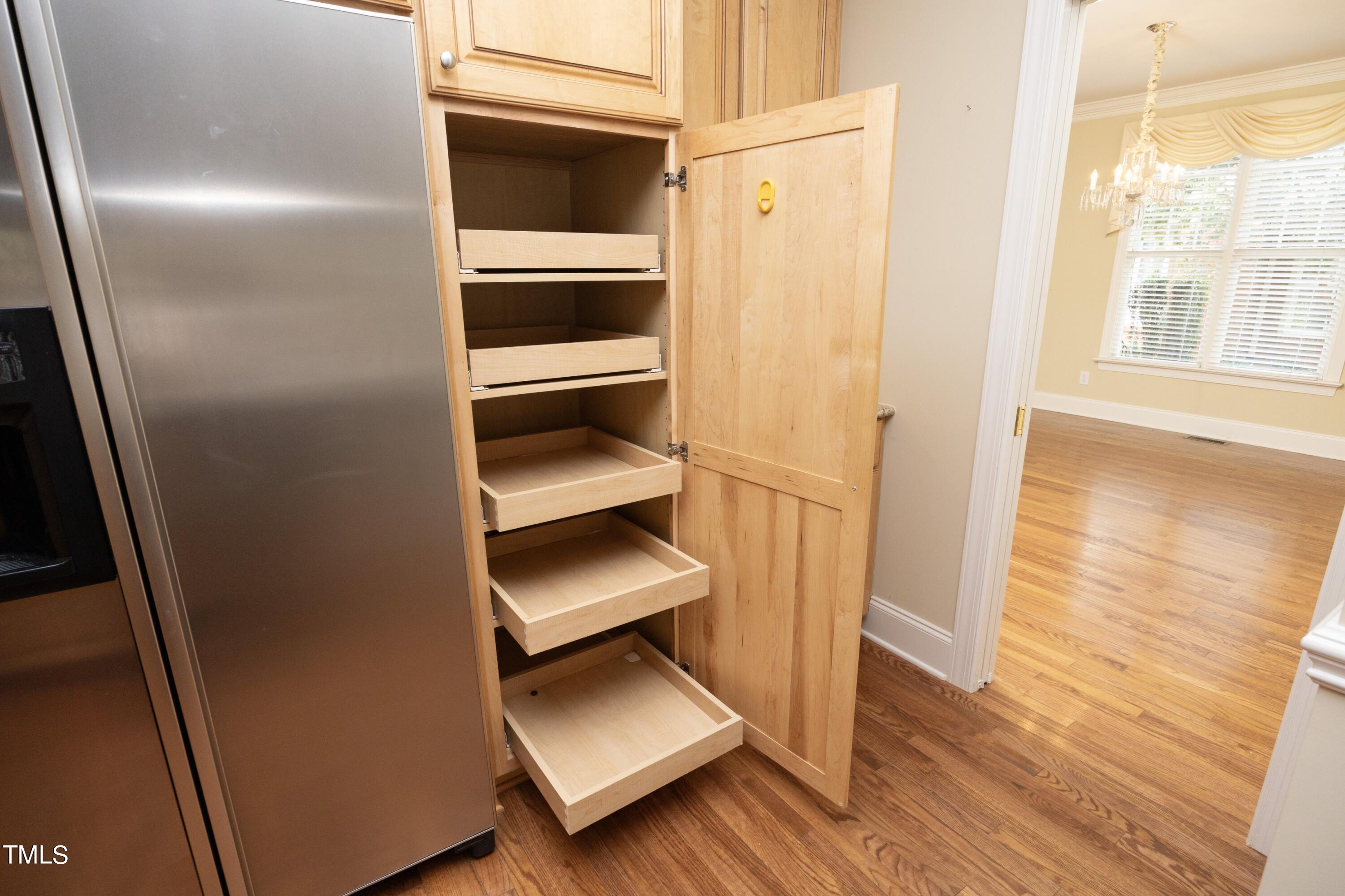 8805 Leeshire Lane Raleigh, NC 27615 - Photo 10 of 26 a view of walk in closet with empty racks