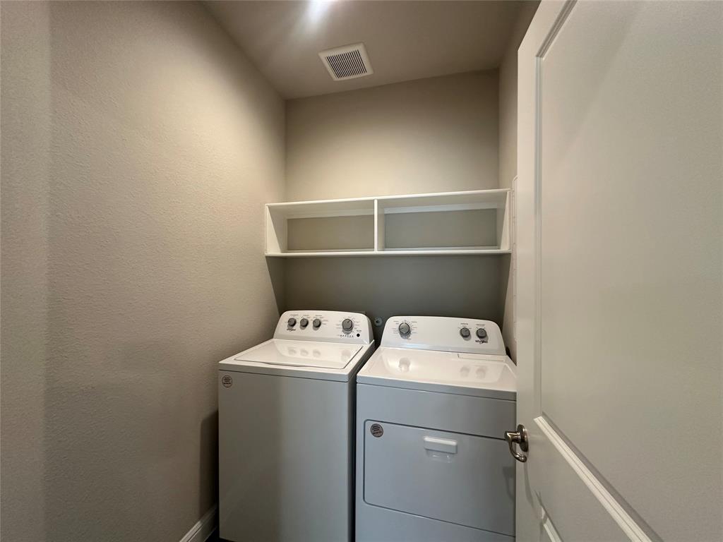 5231 Meadow Lane Krum, TX 76249 - Photo 12 of 17 Laundry area featuring a top-load washer, front-load dryer, and built-in shelving
