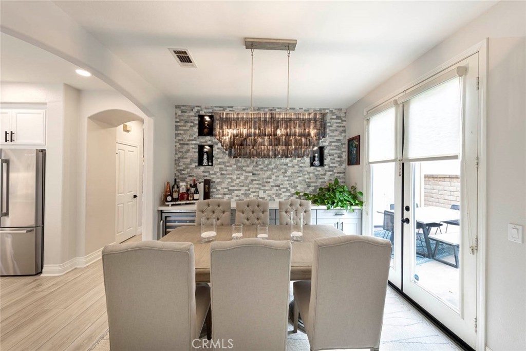 6 Teardrop Irvine, CA 92603 - Photo 12 of 42 a living room with furniture a chandelier and a large window