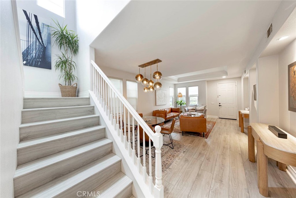 6 Teardrop Irvine, CA 92603 - Photo 21 of 42 a living room with furniture and a chandelier