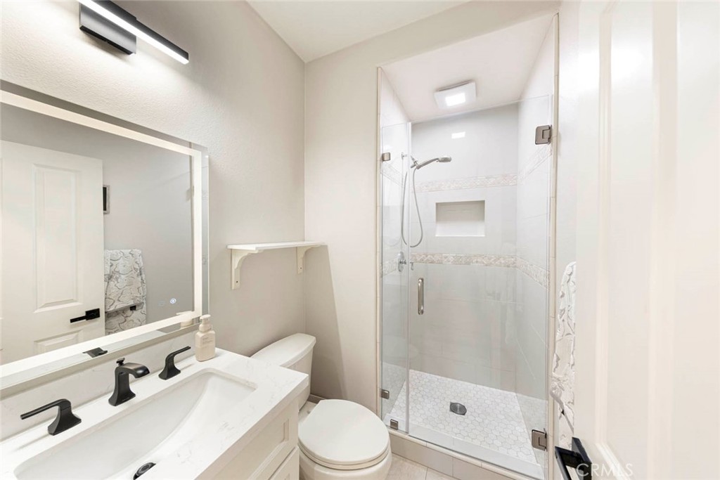 6 Teardrop Irvine, CA 92603 - Photo 9 of 42 a bathroom with a sink a toilet and shower