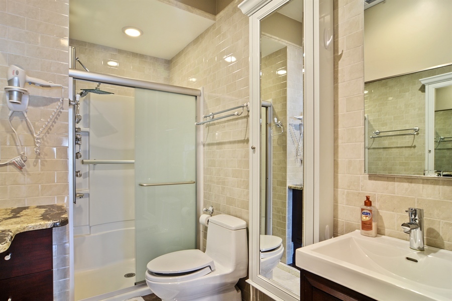 314 West Rand Road Mount Prospect, IL 60056 - Photo 14 of 27 a bathroom with a sink a toilet and shower