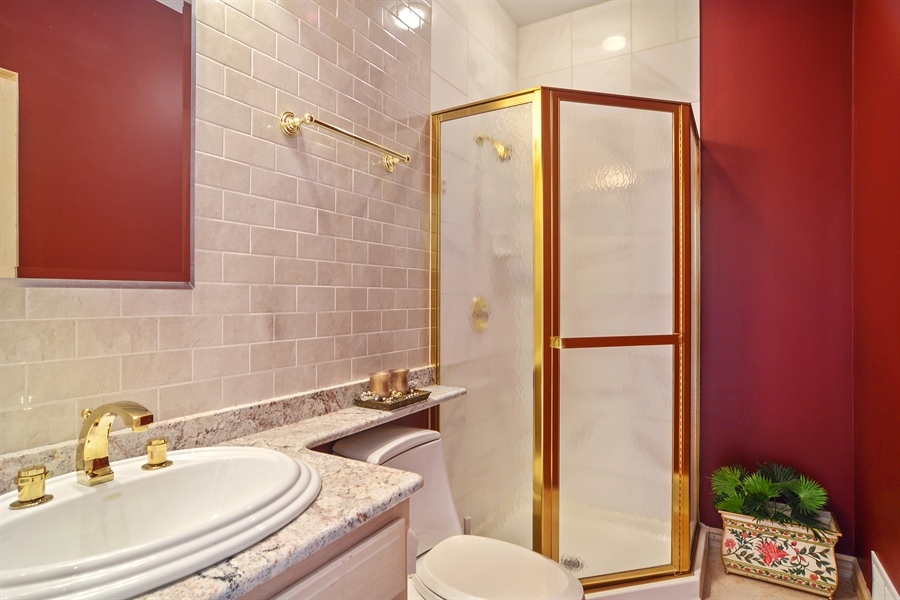 314 West Rand Road Mount Prospect, IL 60056 - Photo 16 of 27 a bathroom with a sink toilet and shower