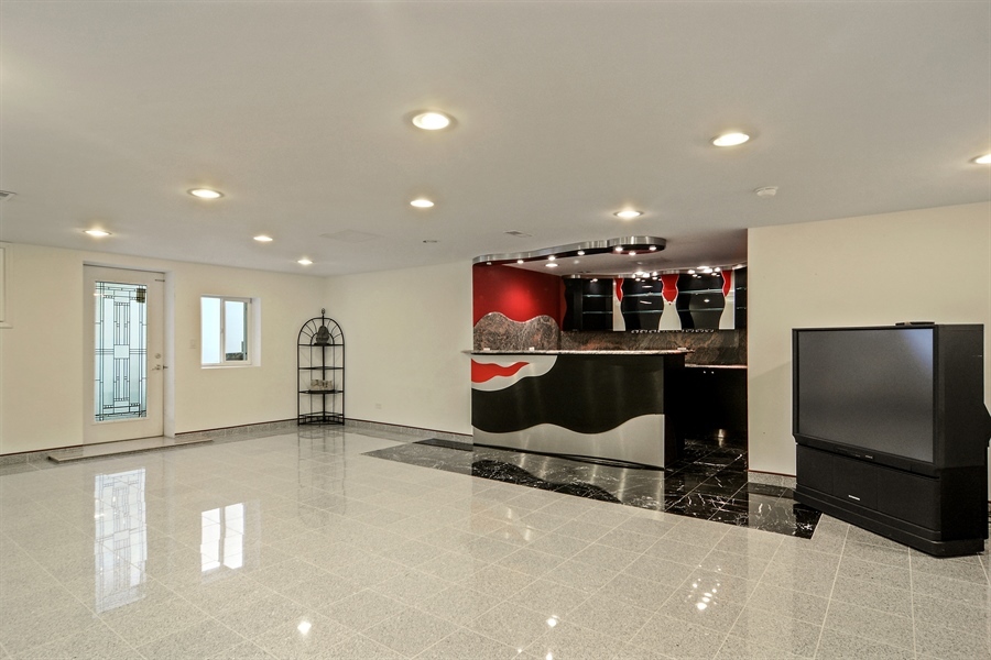 314 West Rand Road Mount Prospect, IL 60056 - Photo 22 of 27 a room with gym equipment and a flat screen tv
