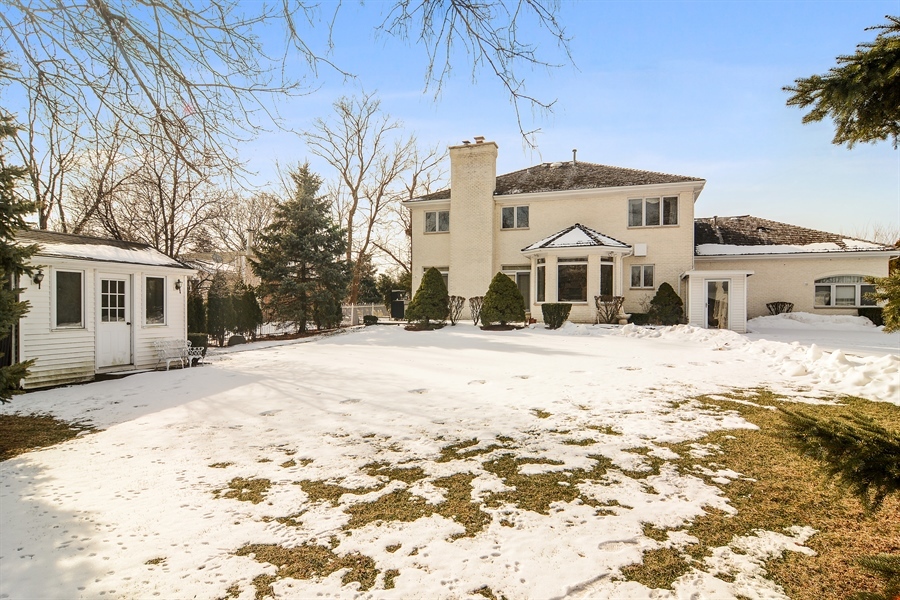 314 West Rand Road Mount Prospect, IL 60056 - Photo 23 of 27 a front view of a house with a yard covered in snow