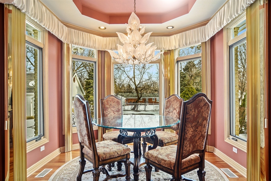 314 West Rand Road Mount Prospect, IL 60056 - Photo 4 of 27 a view of a dining room with furniture wooden floor and chandelier