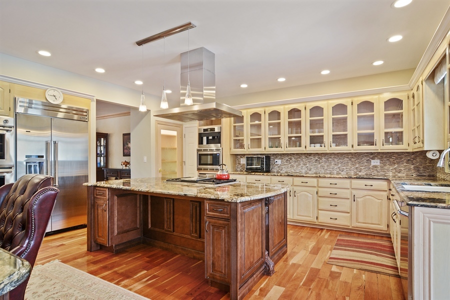 314 West Rand Road Mount Prospect, IL 60056 - Photo 6 of 27 a kitchen with stainless steel appliances granite countertop a stove and cabinets