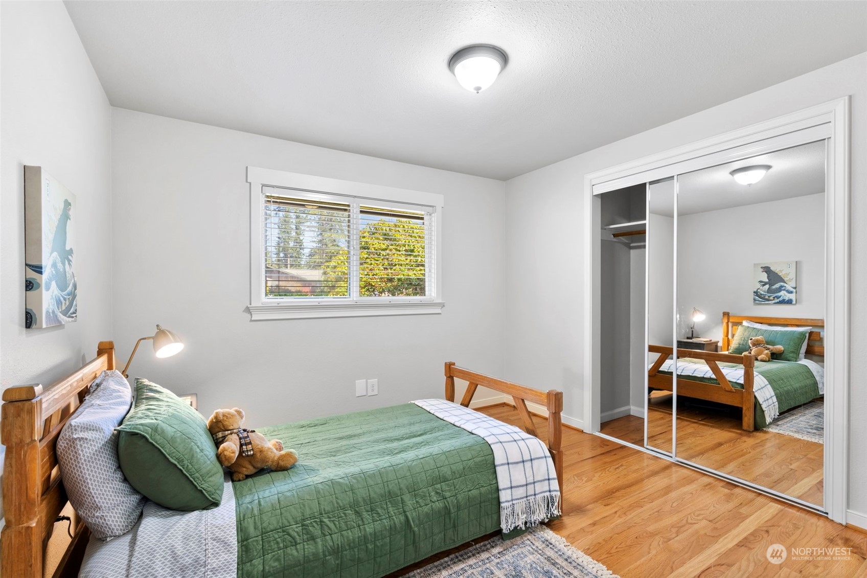 220 161st Street Southeast Bothell, WA 98012 - Photo 23 of 34 a bedroom with a bed and wooden floor