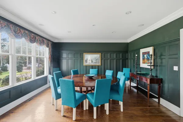 a view of a dining room with furniture window and wooden floor