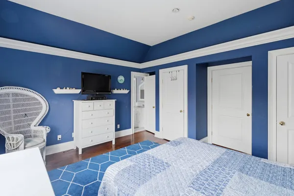 a bedroom with a bed and furniture