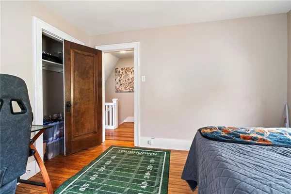 a view of an empty room and wooden floor