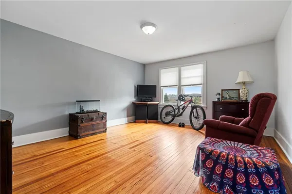 a living room with furniture a couch and a flat screen tv