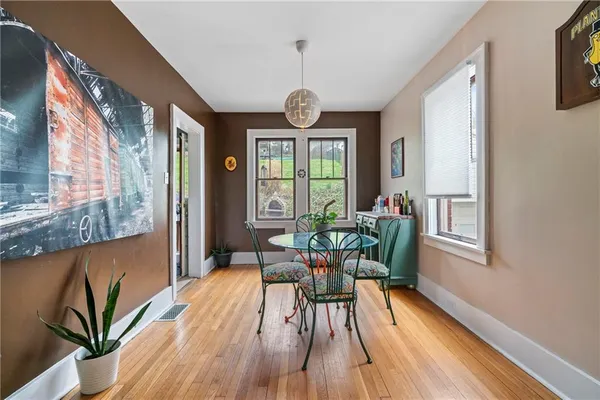 a dining room with furniture window wooden floor