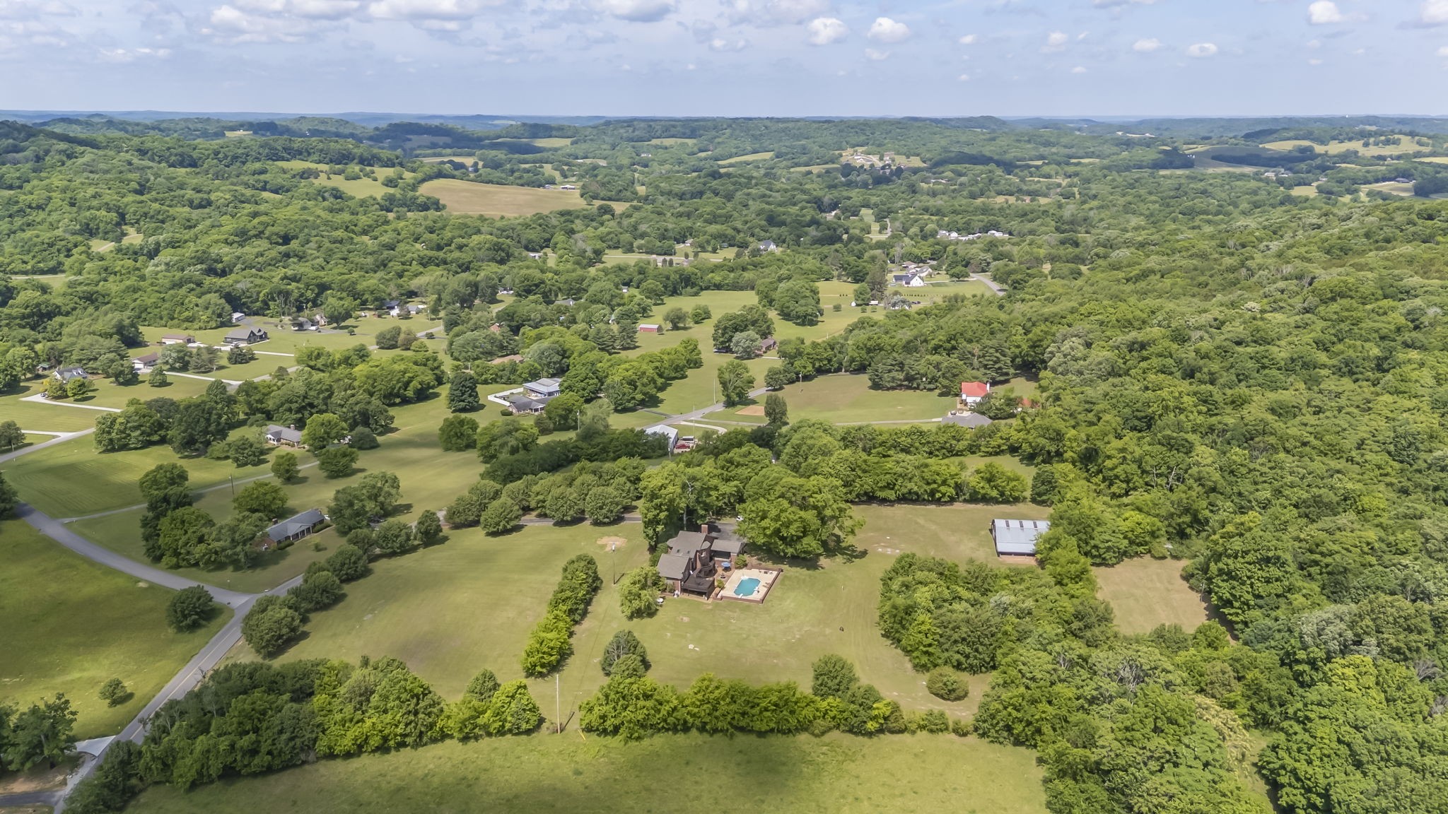 1979 Buck Daniels Road Culleoka, TN 38451 - Photo 60 of 61 an aerial view of residential houses with outdoor space and trees