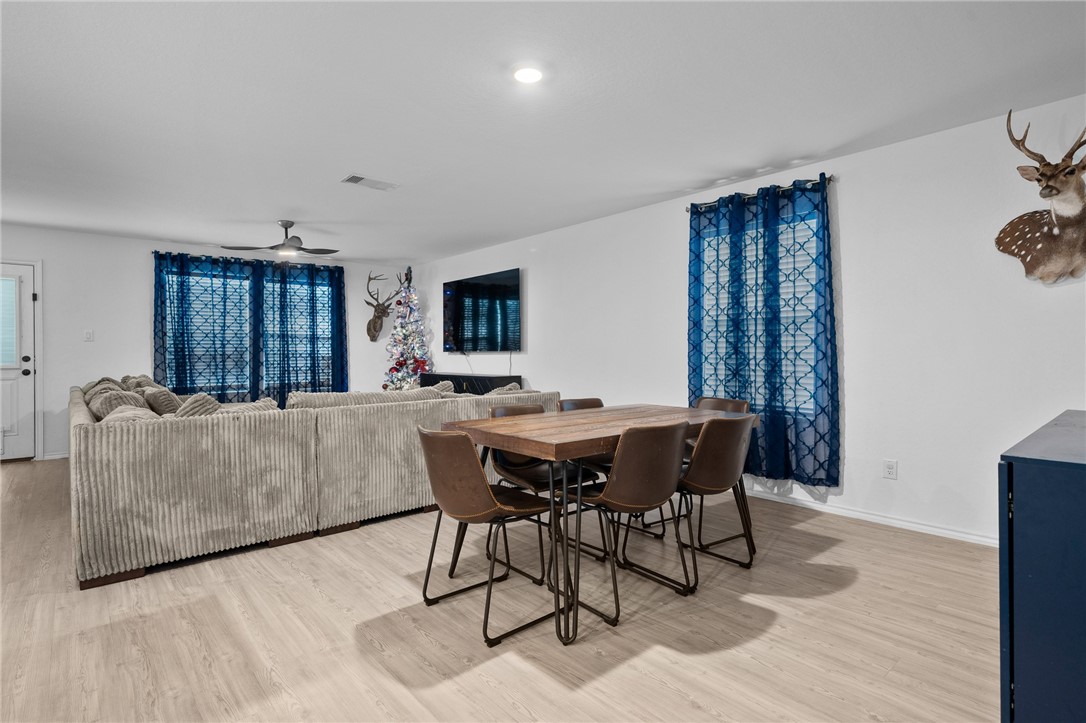 1118 Demeter Drive Portland, TX 78374 - Photo 14 of 28 a living room with furniture a dining table and a window