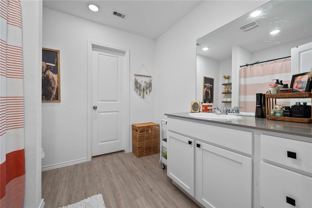 1118 Demeter Drive Portland, TX 78374 - Photo 20 of 28 a kitchen with white cabinets and sink