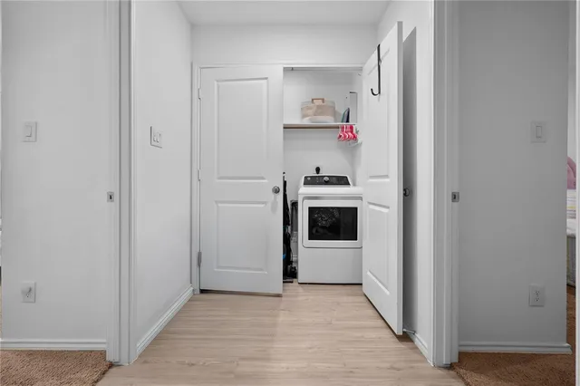 a view of a yard with wooden fence