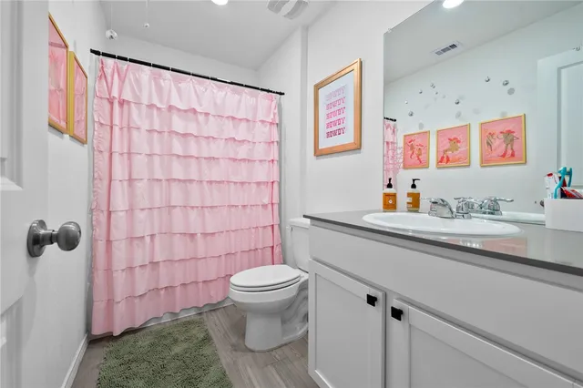 a view of kitchen with stainless steel appliances granite countertop refrigerator sink and stove