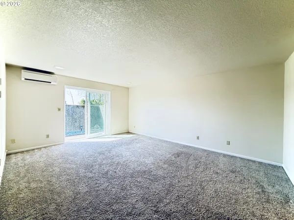 an empty room with an empty space and window