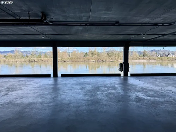 a view of room with wooden floor and sink