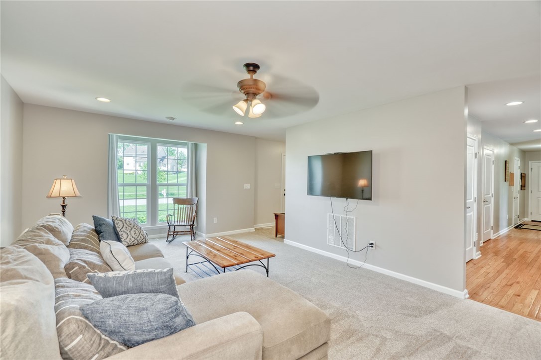 32 Ashlyn Rise Penfield, NY 14450 - Photo 12 of 50 Living room with window that looks out the front o
