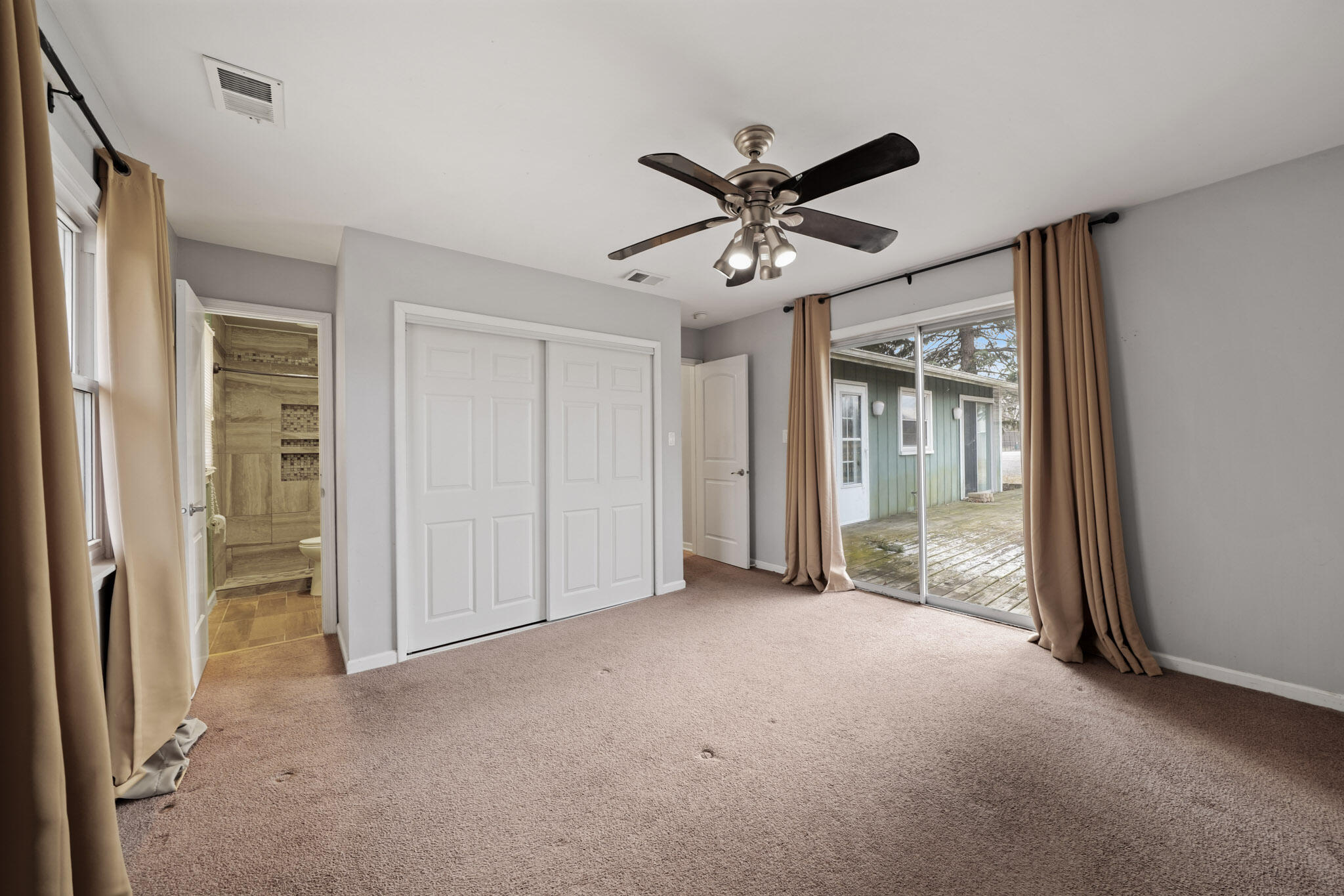 3339 Windy Hill Road Crown Point, IN 46307 - Photo 12 of 25 a view of a big room with closet and a chandelier fan