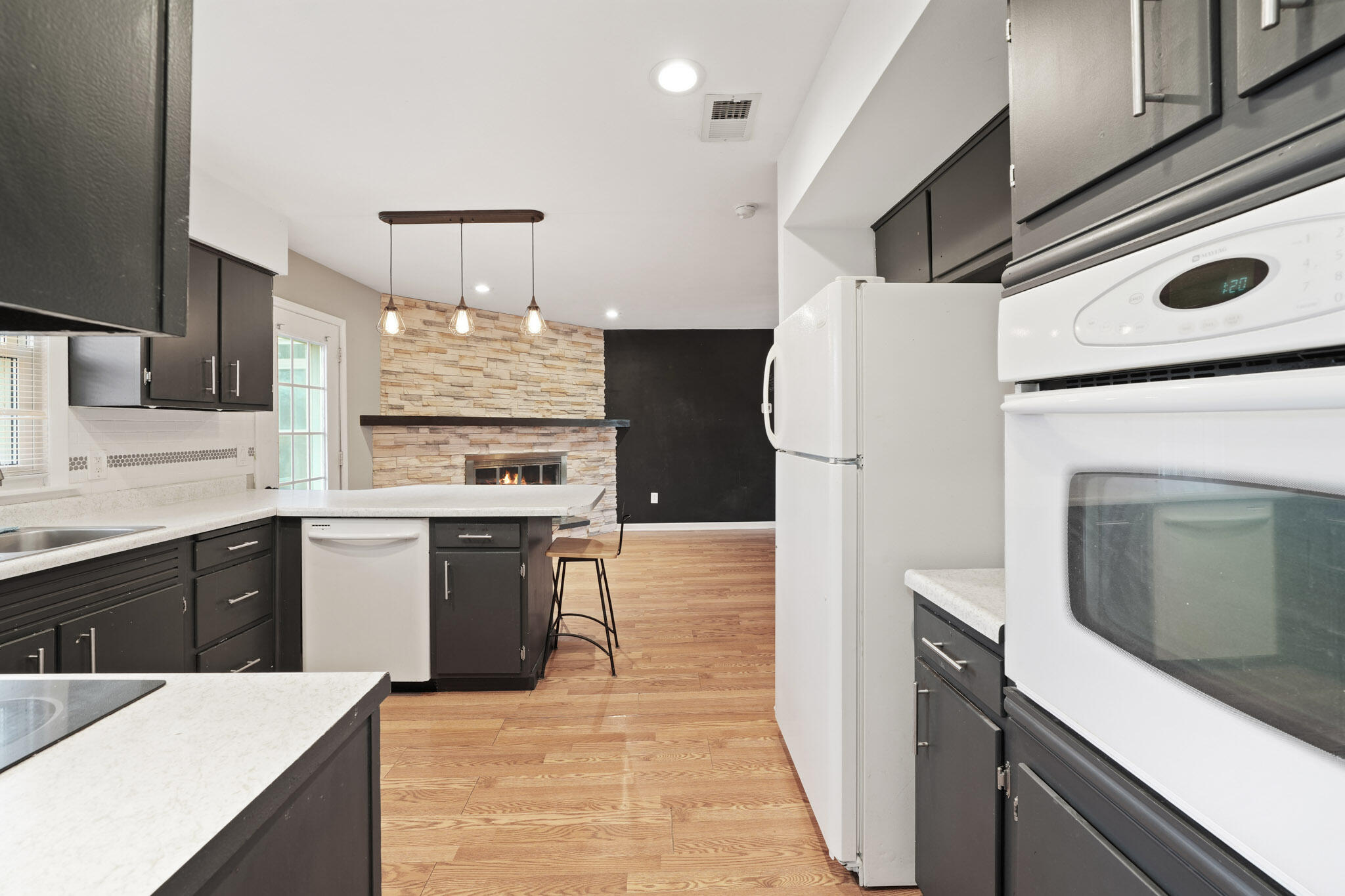 3339 Windy Hill Road Crown Point, IN 46307 - Photo 2 of 25 a kitchen with a refrigerator sink and stove