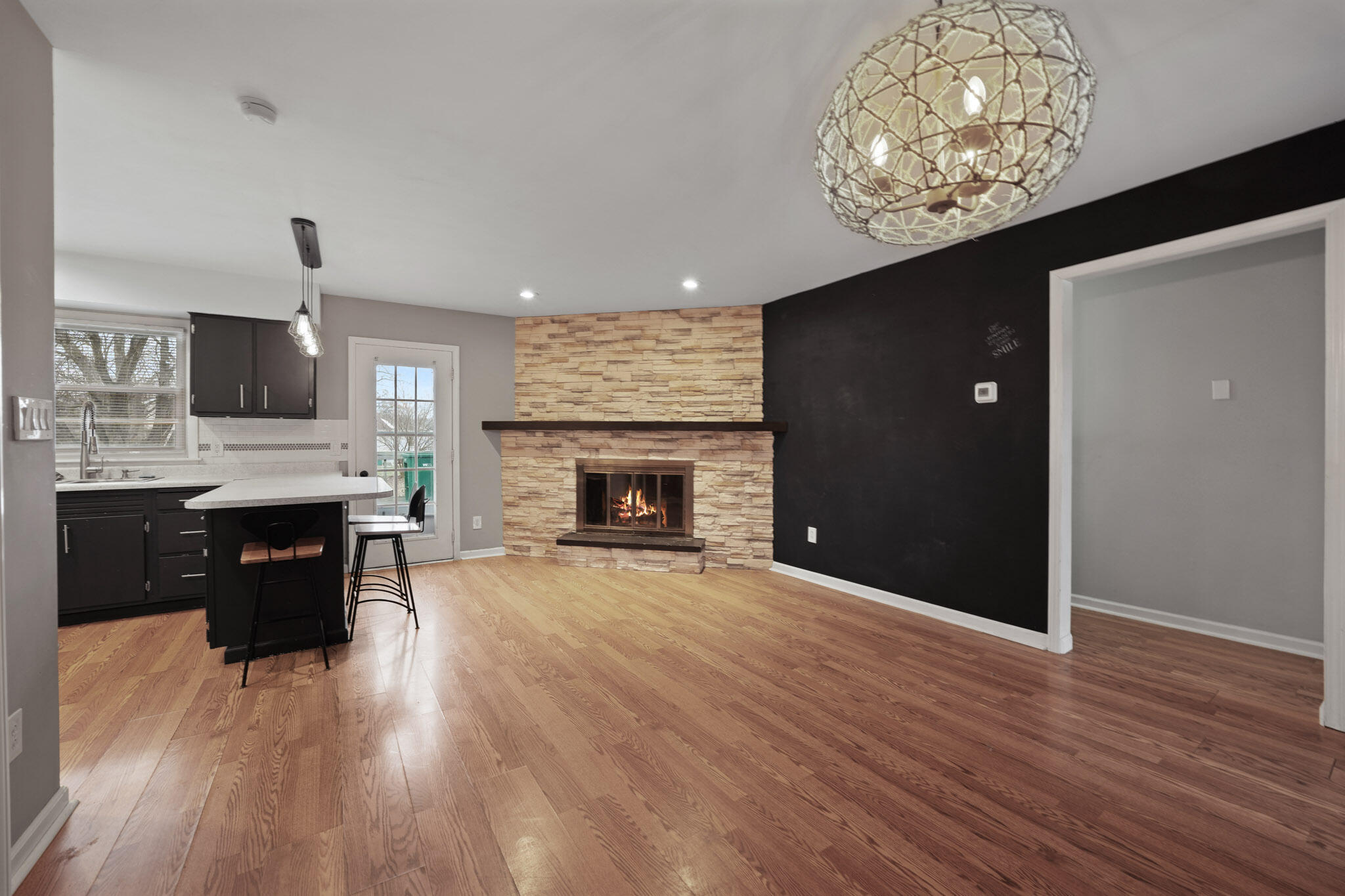 3339 Windy Hill Road Crown Point, IN 46307 - Photo 6 of 25 a view of kitchen with livingroom and fireplace