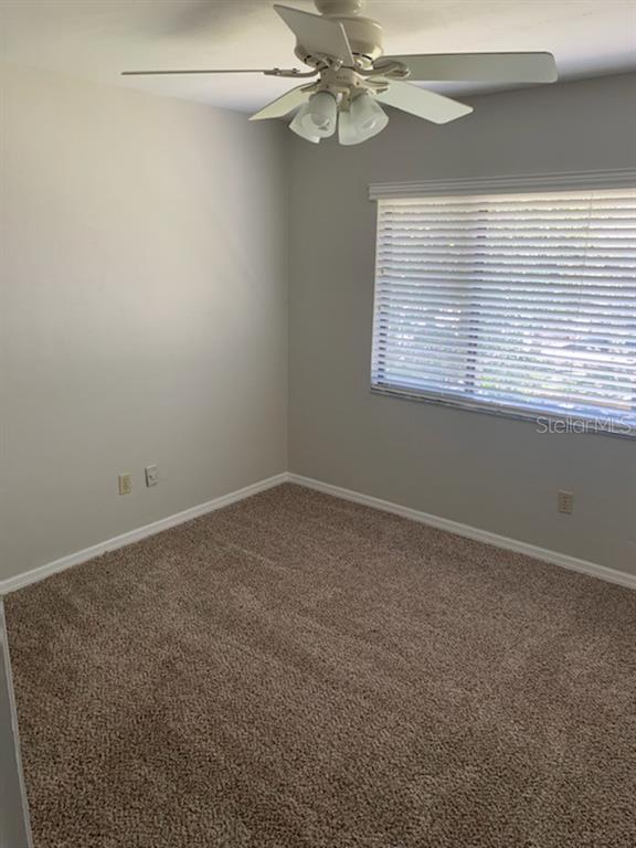 6206 Southwest 8th Lane Gainesville, FL 32607 - Photo 11 of 15 an empty room with a window