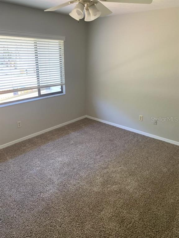 6206 Southwest 8th Lane Gainesville, FL 32607 - Photo 12 of 15 an empty room with a window