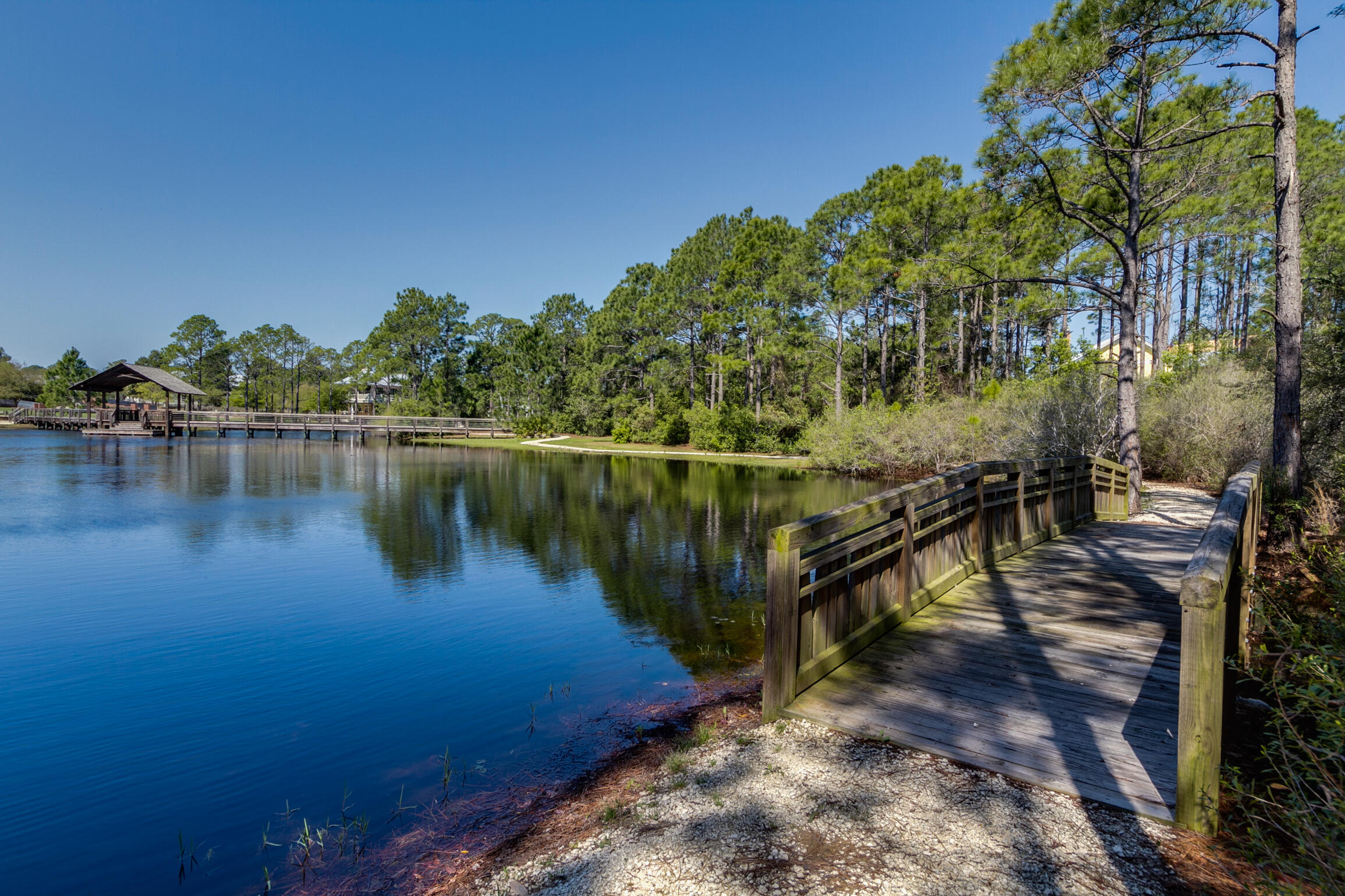 34 Okeechobee West Santa Rosa Beach, FL 32459 - Photo 64 of 91 a view of a lake with boats and trees in the background