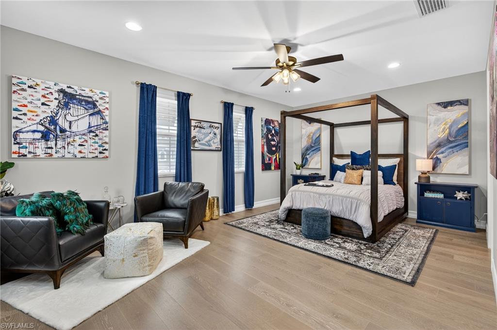 14690 Reserve Place Naples, FL 34109 - Photo 28 of 48 Bedroom featuring recessed lighting, wood finished floors, and a ceiling fan