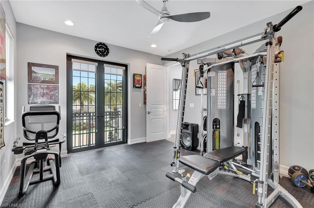14690 Reserve Place Naples, FL 34109 - Photo 35 of 48 Exercise area with ceiling fan and french doors
