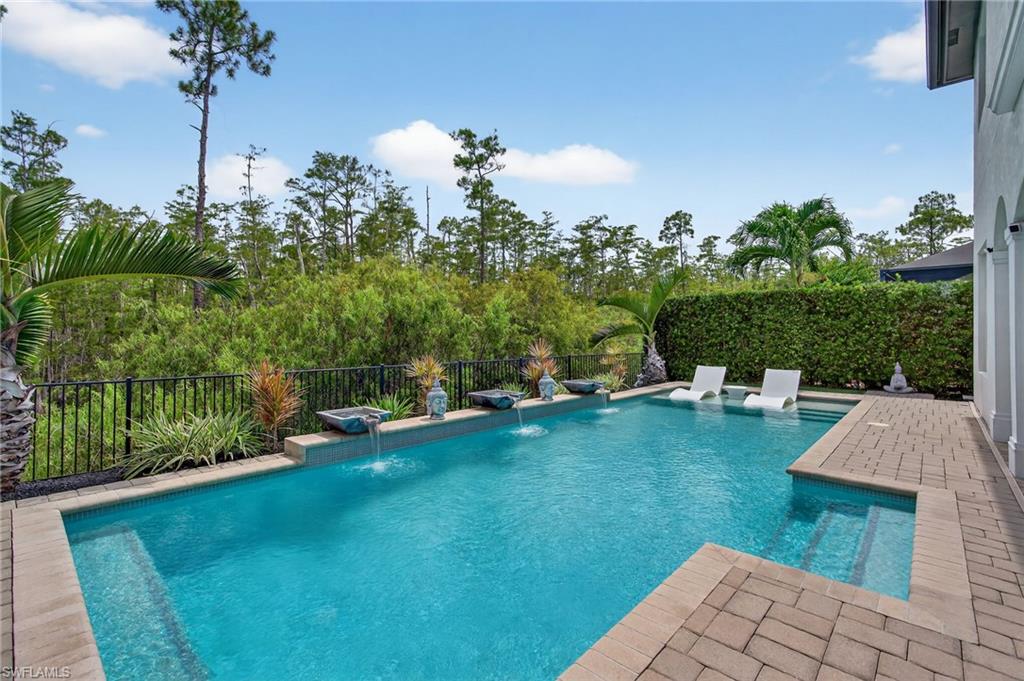 14690 Reserve Place Naples, FL 34109 - Photo 42 of 48 View of swimming pool featuring a patio area