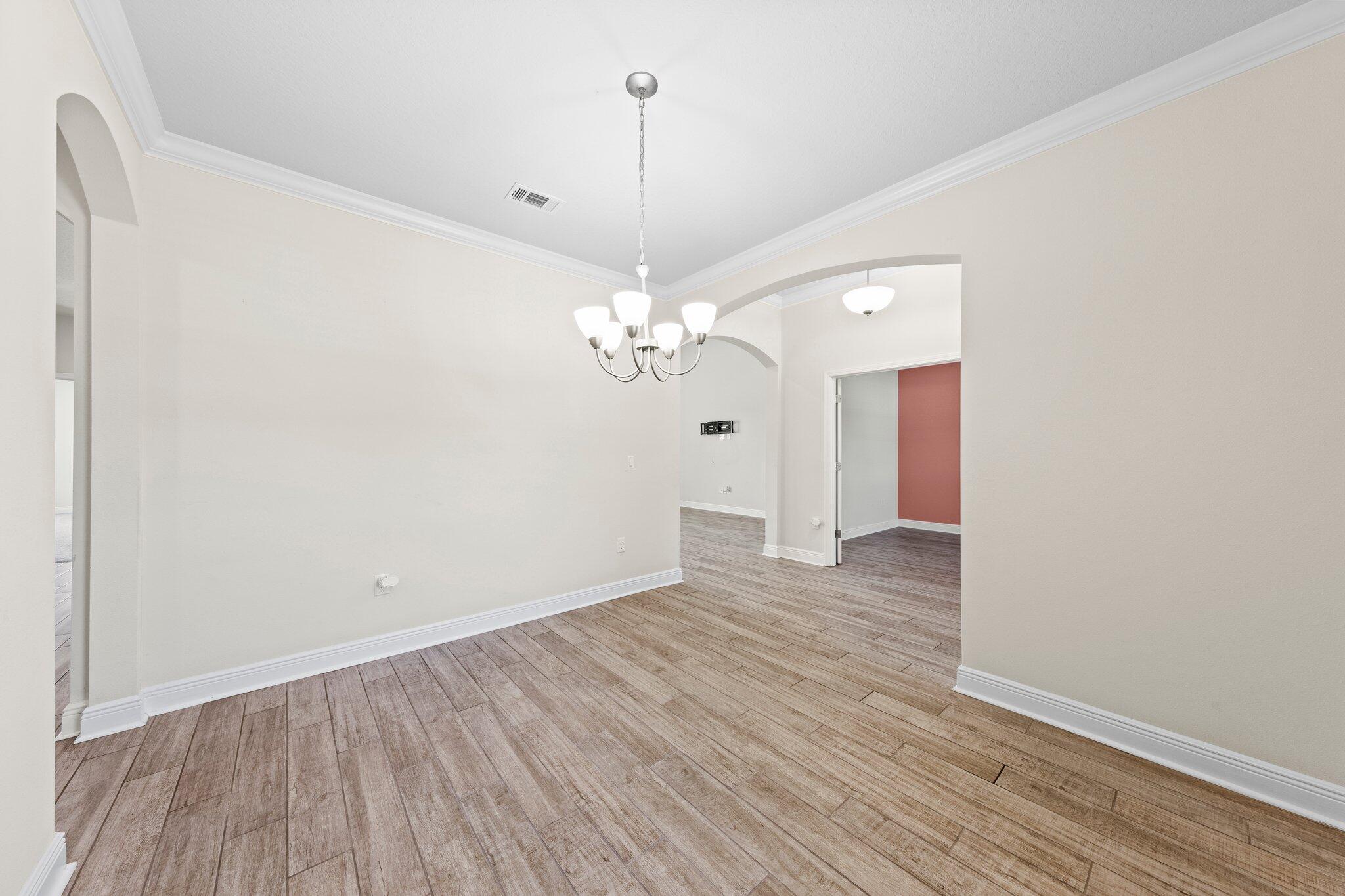 91 Sweet Tea Lane Freeport, FL 32439 - Photo 19 of 80 a view of a room with wooden floor and ceiling fan