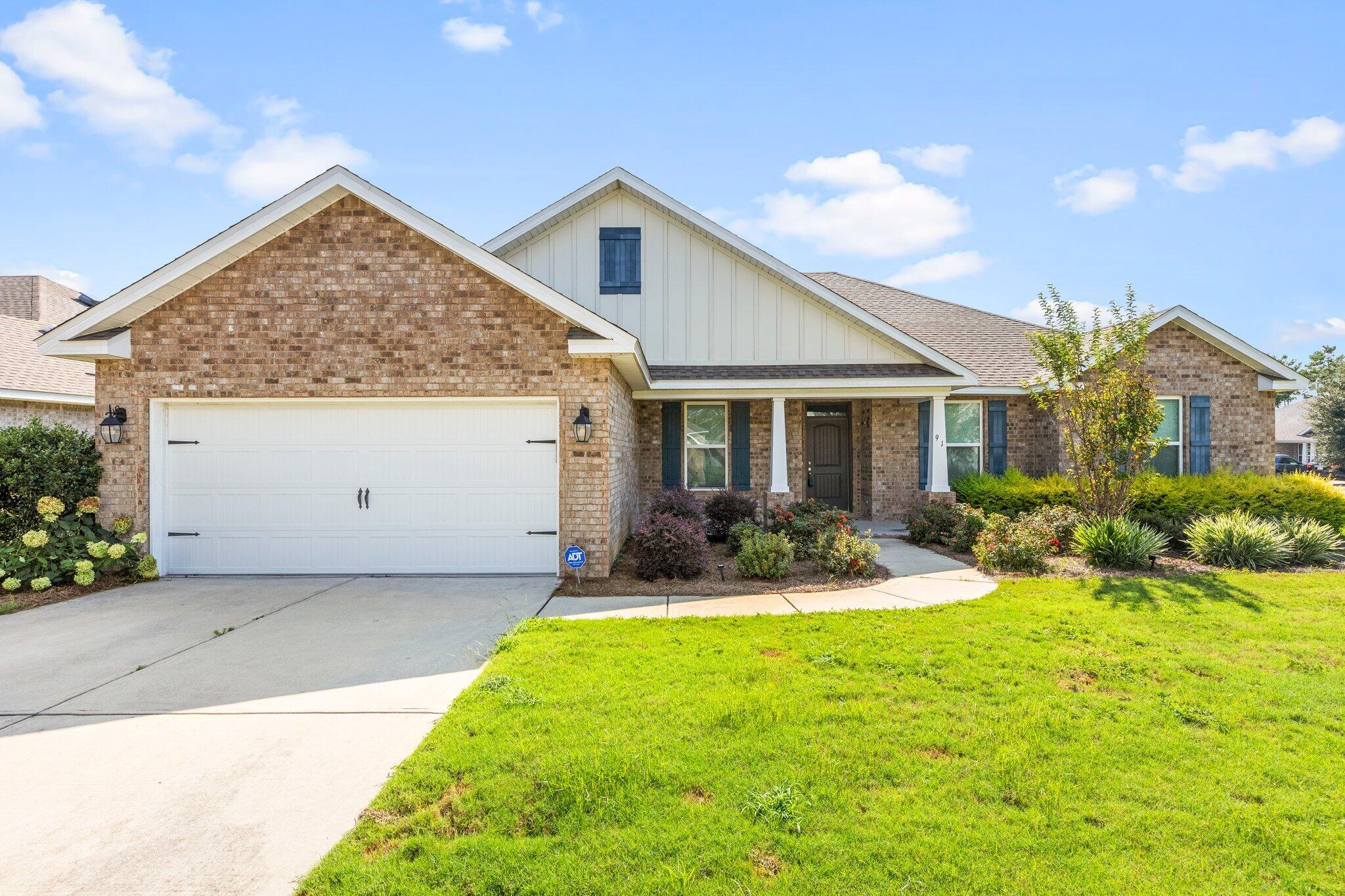91 Sweet Tea Lane Freeport, FL 32439 - Photo 2 of 80 a view of a house with backyard porch and sitting area