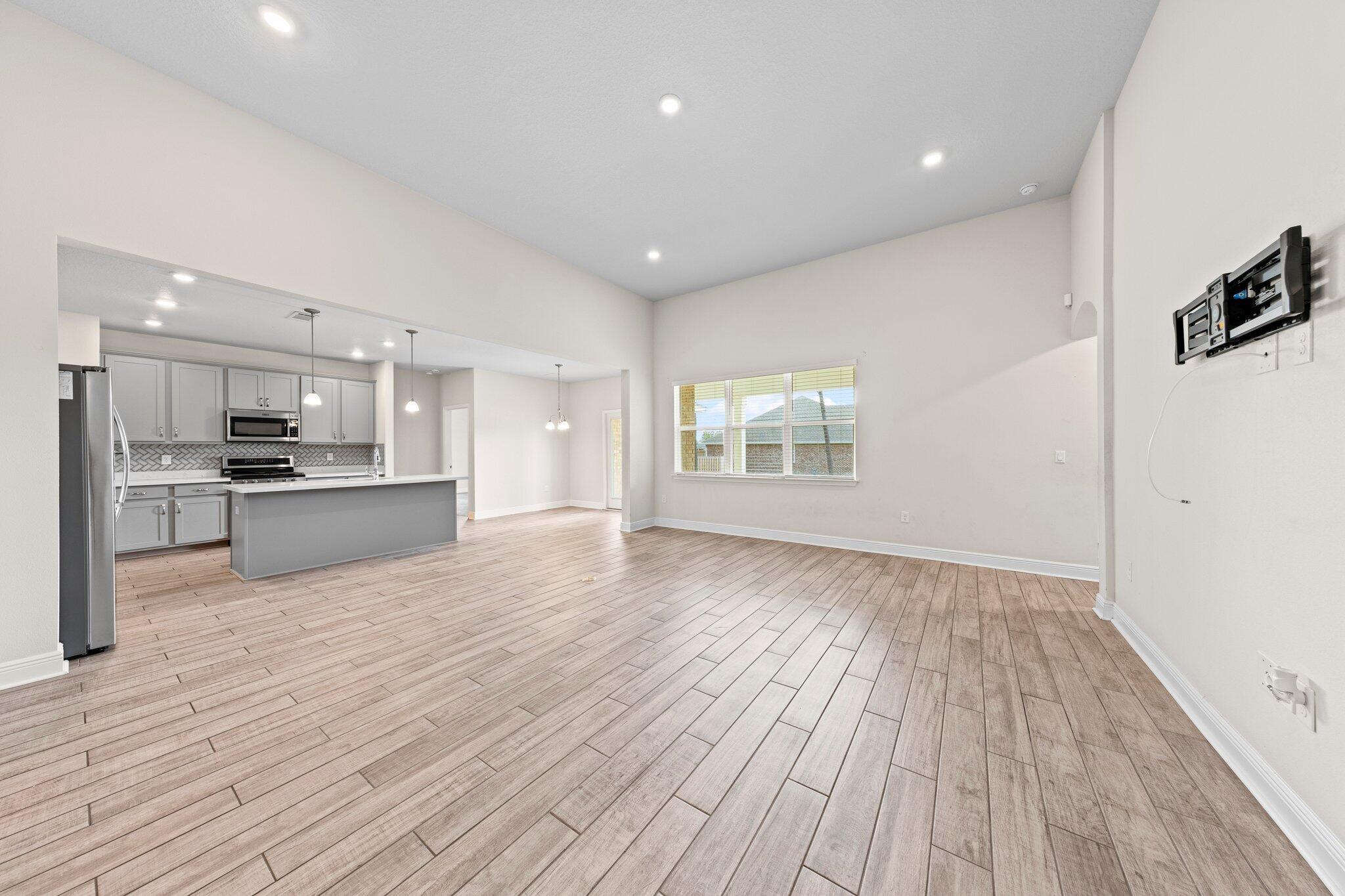 91 Sweet Tea Lane Freeport, FL 32439 - Photo 25 of 80 a view of kitchen with wooden floor and electronic appliances